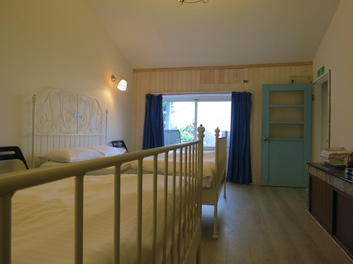 Sunnyrain Hostel Цзюфэнь Экстерьер фото